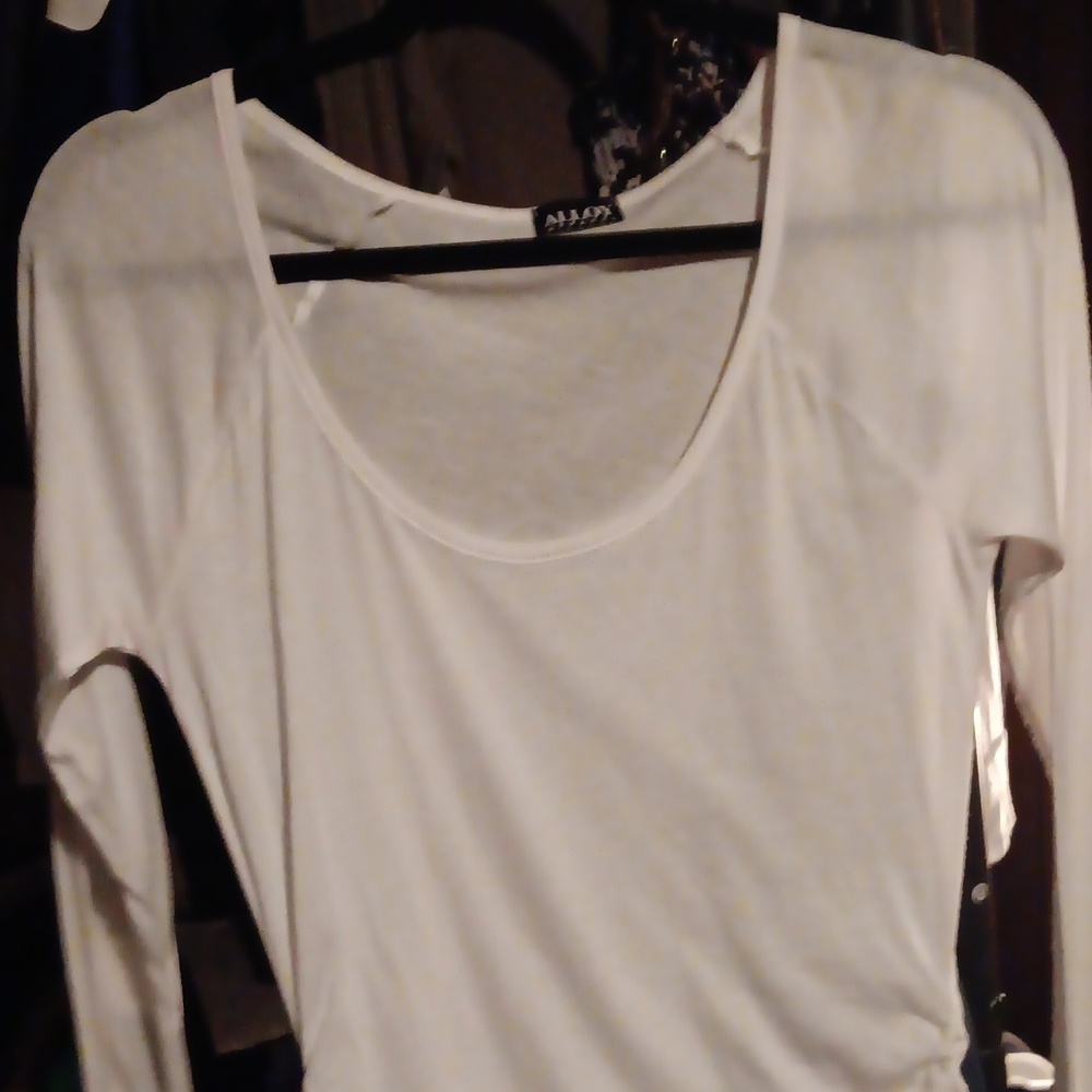 Never worn tunic with side ruching,holes for your thumbs on the sleeves size s